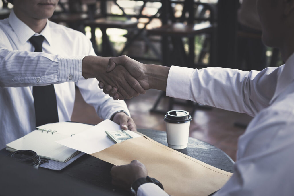 business partners handshaking after business succe 2025 10 16 03 45 57 utc scaled.jpg